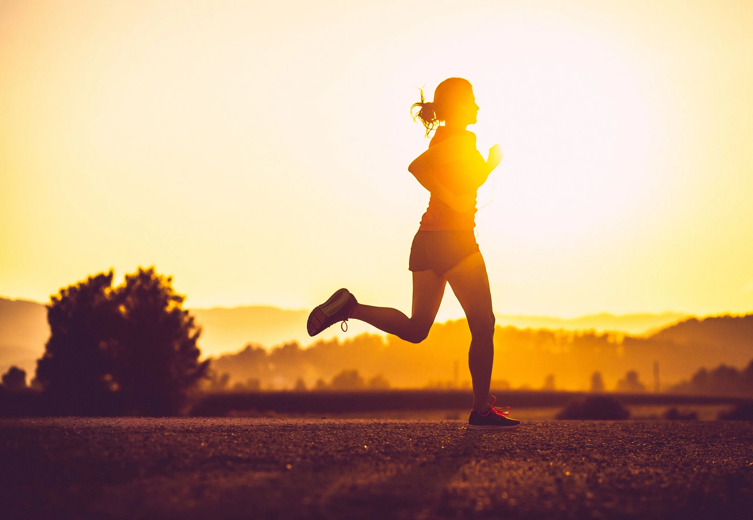 woman running at sunshine